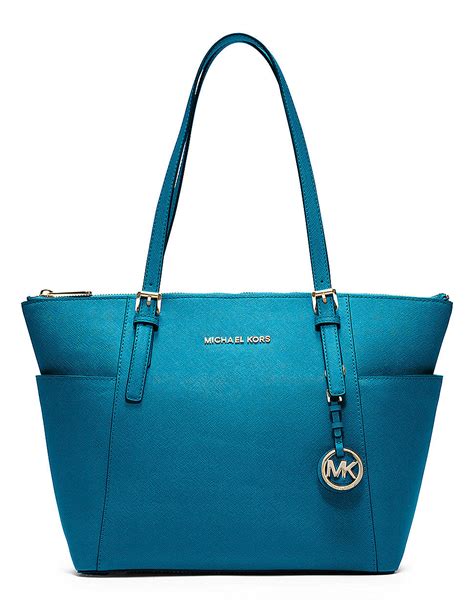 michael kors jet set small tote turquoise|Michael Kors bag with airplanes.